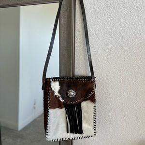 Genuine leather, handmade, crossbody hide purse.